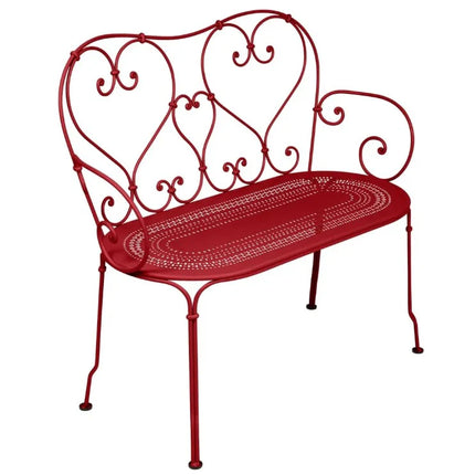Colorful Fermob 1900 decorative bench with wooden slats and metal frame, suitable for indoor or outdoor use.
