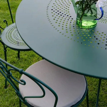 Fermob 1900 outdoor chair with a woven seat and armrests, featuring a classic design in bright, weather-resistant finish.