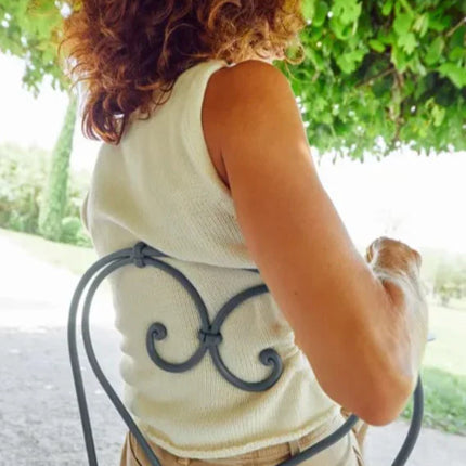 Fermob 1900 outdoor chair with metal frame, lightweight design, and vibrant color, suitable for outdoor seating and patio decor.