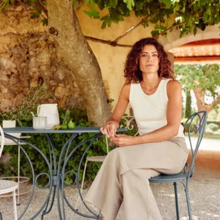 Fermob 1900 outdoor chair with metal frame and slatted seat, designed for outdoor patio and garden use.