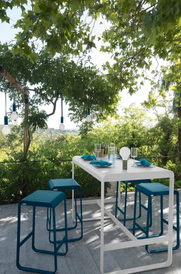 Fermob Bellevie high outdoor lounge table, 140x80 cm, with sleek design ideal for outdoor food service or hospitality settings.