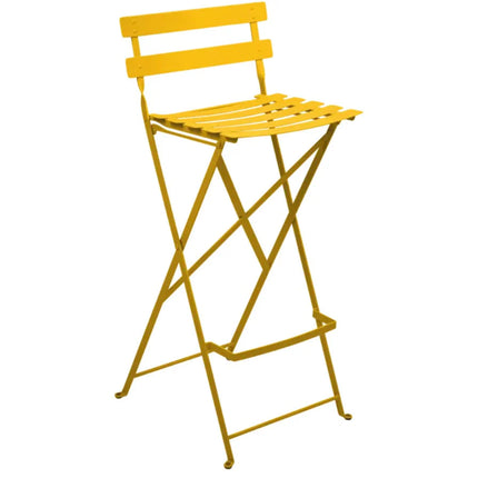 Fermob Bistro High Stool, a foldable bar chair with a sleek design, suitable for outdoor hotel and restaurant settings.