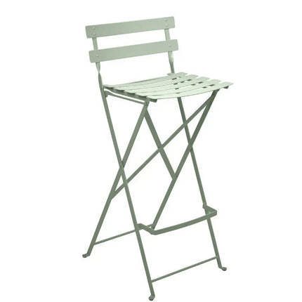 Fermob Bistro High Stool, foldable bar chair with metal frame and wooden seat, suitable for outdoor restaurant or hotel bar seating.