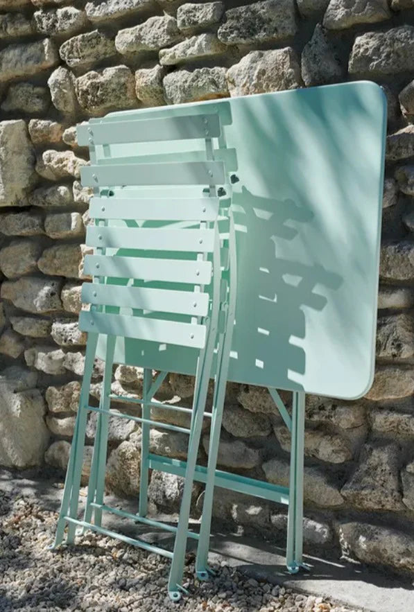 Fermob Bistro Classique folding chair with metal frame, designed for outdoor dining and hospitality settings.