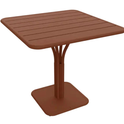 Dark red Fermob Luxembourg Pedestal Outdoor Table, 80x80 cm, showcasing its sturdy metal design and sleek square shape.
