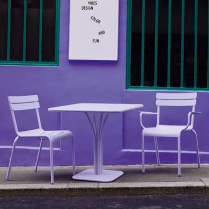 Fermob Luxembourg outdoor pedestal table, 80x80 cm, purple with a sleek, modern design for outdoor dining or patio use.