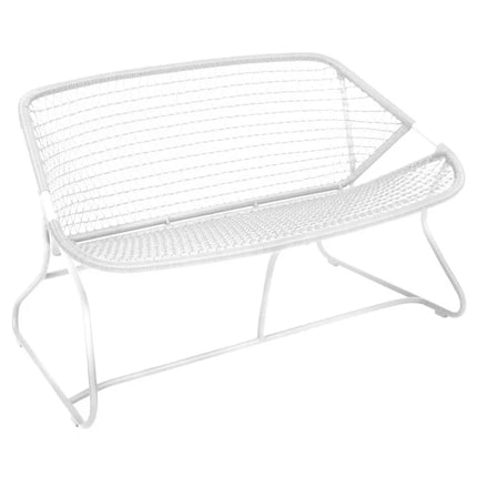 Fermob Sixties outdoor sofa with colorful cushions and modern design, perfect for stylish outdoor seating.