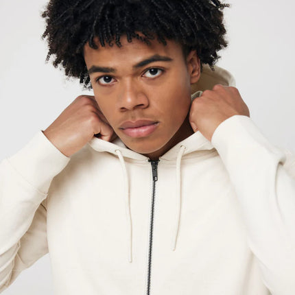 Recycled cotton zip-through hoodie by iqoniq, showcasing the textile's soft fabric and casual fit on a model.