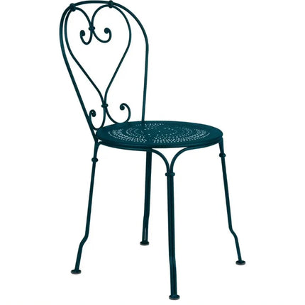 Fermob 1900 outdoor metal chair with colorful painted finish, suitable for hotel, restaurant, or cafe outdoor seating.